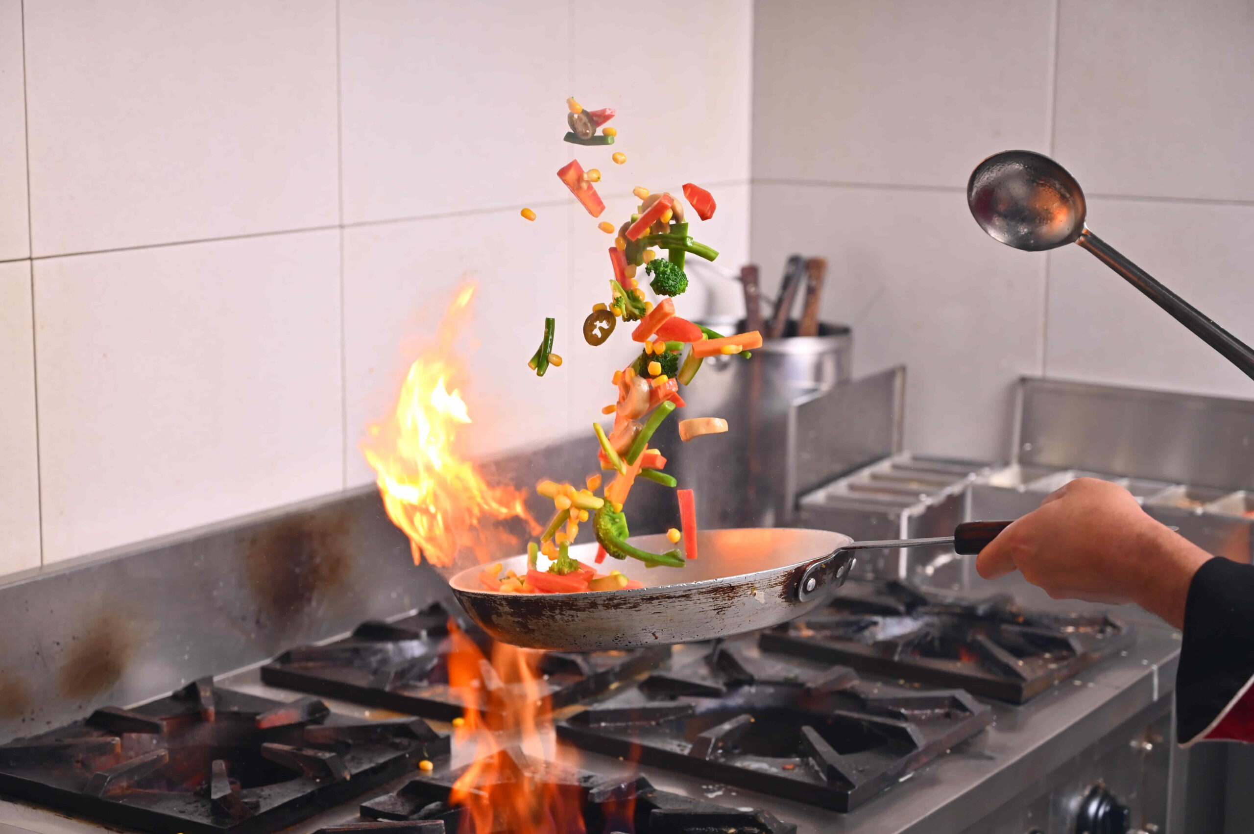 Chef preparing a dish at Pulse Restaurant